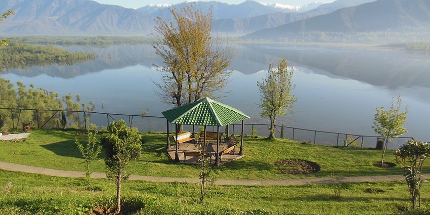 Wular Lake, one of the largest fresh water lakes in India, surrounded by mountains