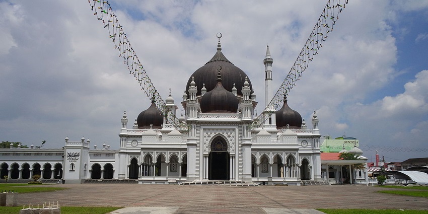 A scenic view of the iconic Zahir Mosque in Malaysia showcasing intricate craftsmanship.