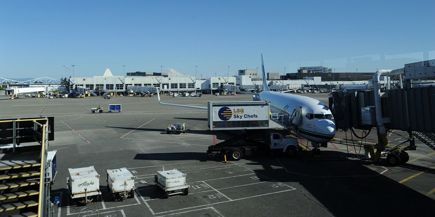 Zhukovsky International Airport's modern glass structure under the morning blue skies welcoming passengers.