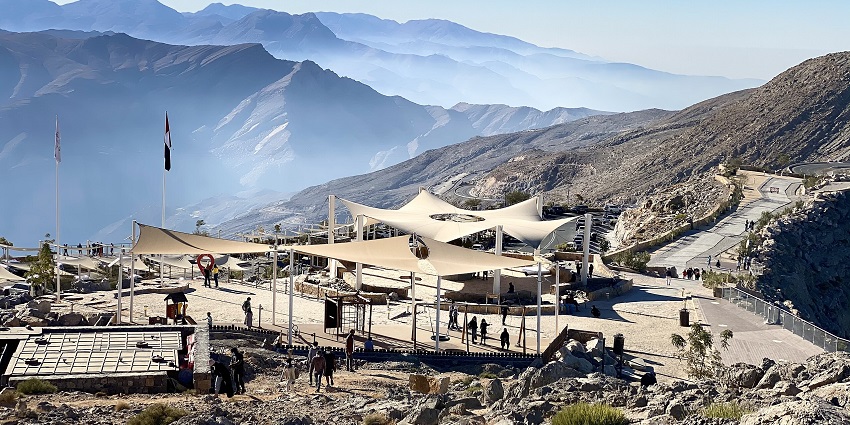 Soar over rugged mountains on Jebel Jais, experiencing the world’s longest zipline