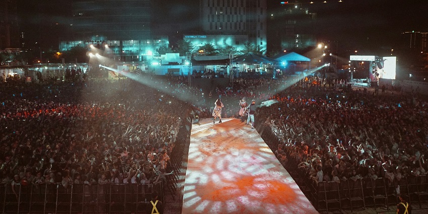 An image of a lively beach party during ZoukOut in Sentosa, Singapore, one of the cultural festival in December.
