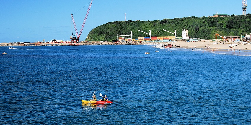 Tourists enjoying beach activities near uShaka Beach, one of the beaches in Durban.