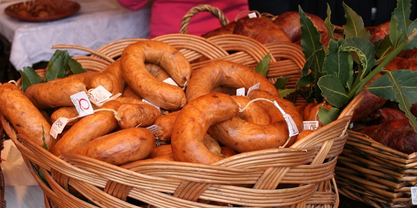 An image of Alheira de Mirandela, a unique sausage among the famous food in Portugal.
