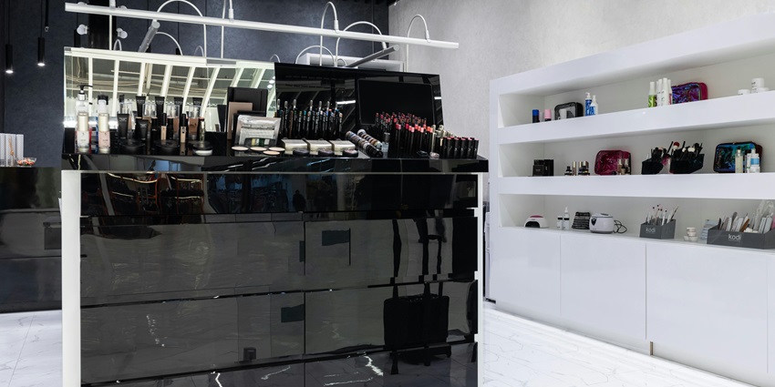 Modern beauty salon cosmetics display arranged on sleek counters under soft lighting