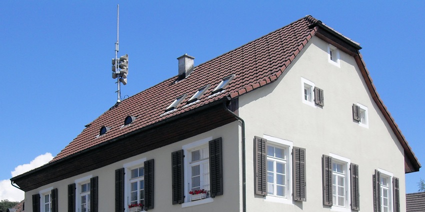 Charming Gemeindehaus building in Gempen, showcasing architecture with a sloping roof.