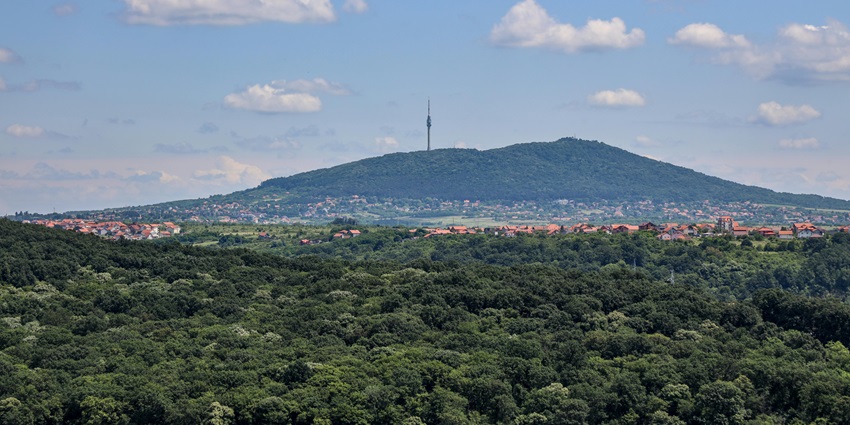 Mountain town nestled in lush green valley with scenic nature and distant peaks–places to visit near belgrade