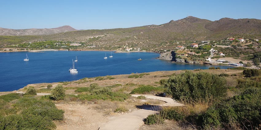 Yachts sailing at Cape Sounion, a place to visit near Athens surrounded by rolling hills.