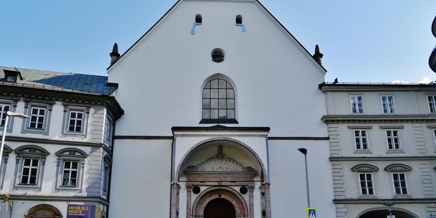A front view of the Court Church, one of the top places to visit in Innsbruck in winter.