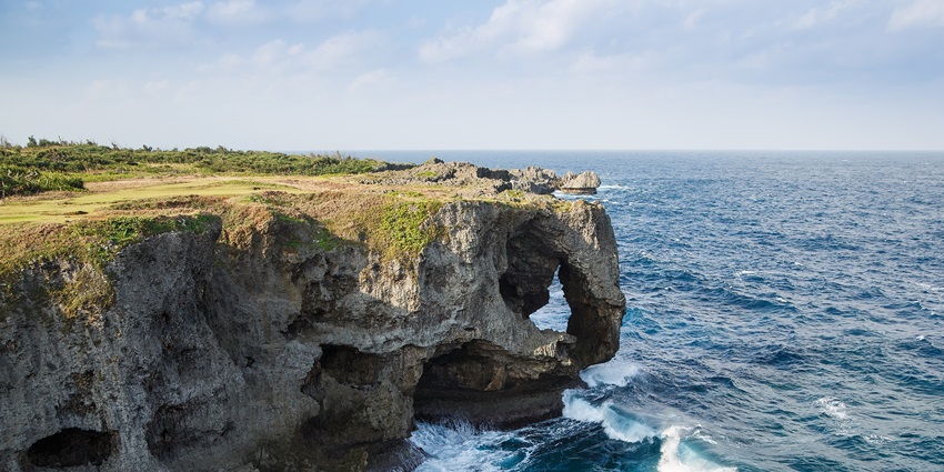 Watching the sunset from Cape Manzamo, one of the most scenic things to do in Okinawa.