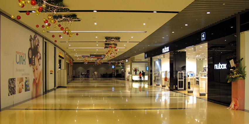 Sleek underground shopping corridor at Marina Bay Link Mall with boutique storefronts, polished floors, one of the best things to see in Marina Bay.