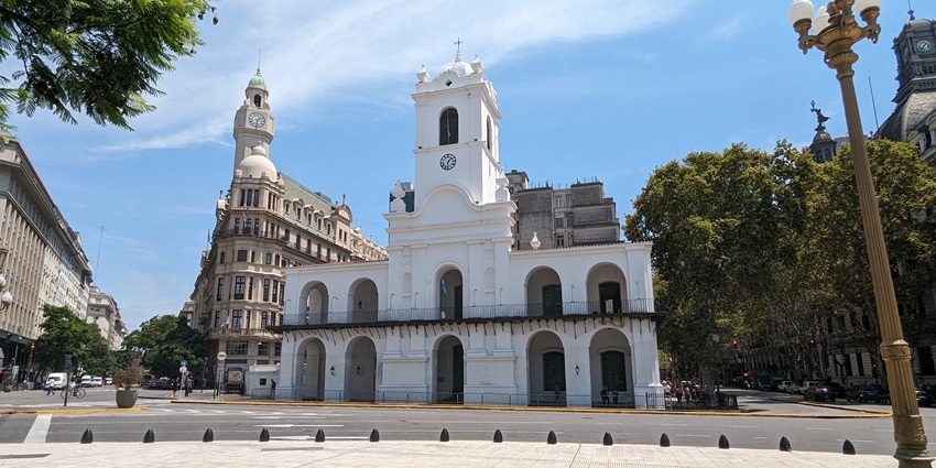The historic Cabildo building in Buenos Aires with colonial architecture and visitors exploring.