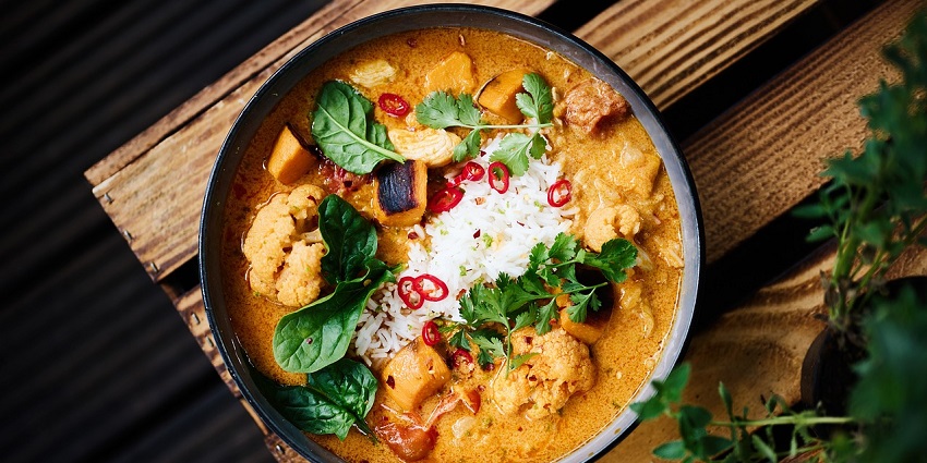  Image of a food item resembling the plate of Fish Ambul Thiyal, sour fish curry cooked with spices.