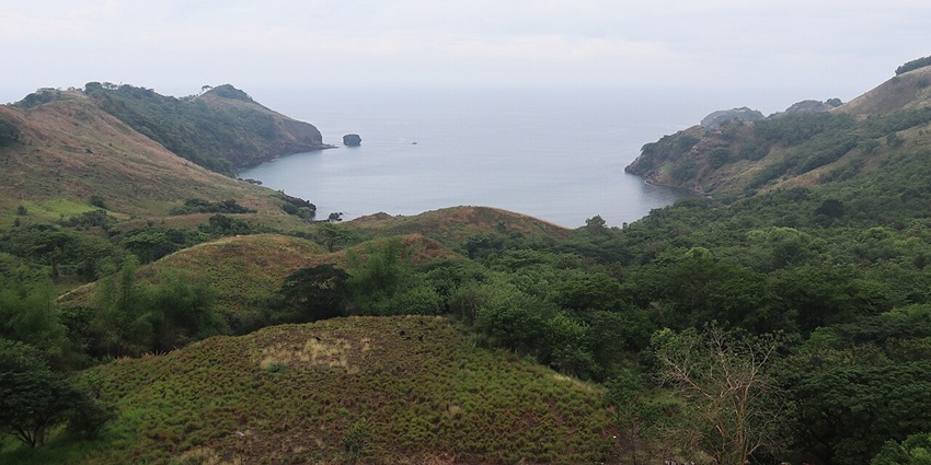 Nagbayog Cove in Mariveles, Bataan, showcasing turquoise waters and rocky formations.