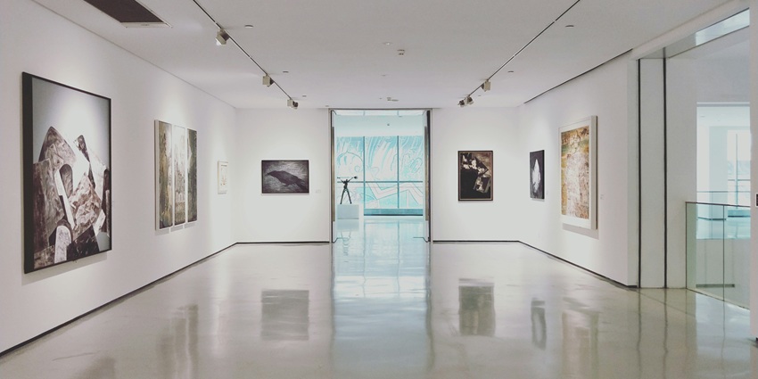 Image of art works hanging on white wall in a museum of arts - one of the best places to visit San Juan Manila