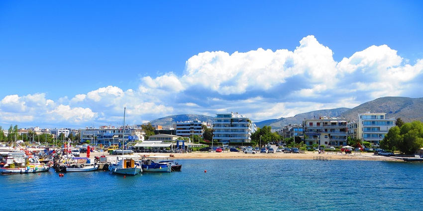 Speedboats parked the Glyfada beach with crystal-clear blue waters in Glyfada, Greece.