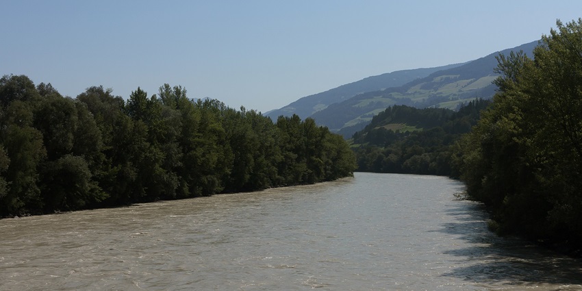 Inn River between Hall in Tirol and Volders, surrounded by lush green landscapes