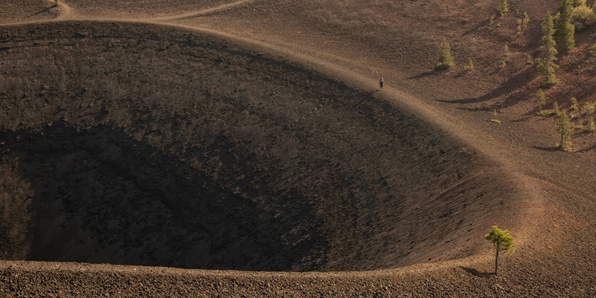 A panoramic view of the lush green Mount Matavanu Crater, surrounded by thick rainforest.