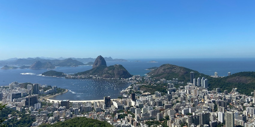 A breathtaking aerial view of Mirante Dona Marta surrounded by an azure water body.
