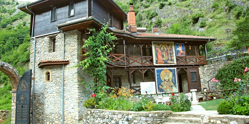 Explore Holy Archangels Monastery, a historic Orthodox site with scenic hillside views.