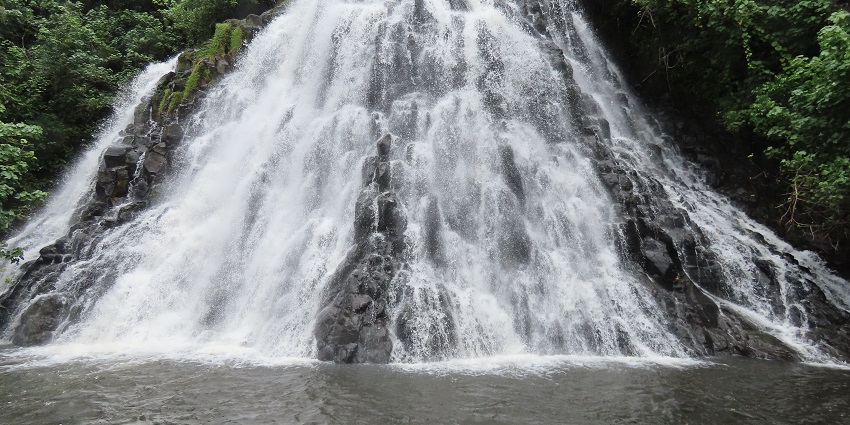 Visiting Kepirohi Waterfall on Pohnpei Island with its stunning cascades and lush surroundings.