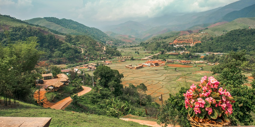 A breathtaking view of Khao Sam Muk Hill featuring verdant valleys and majestic peaks.
