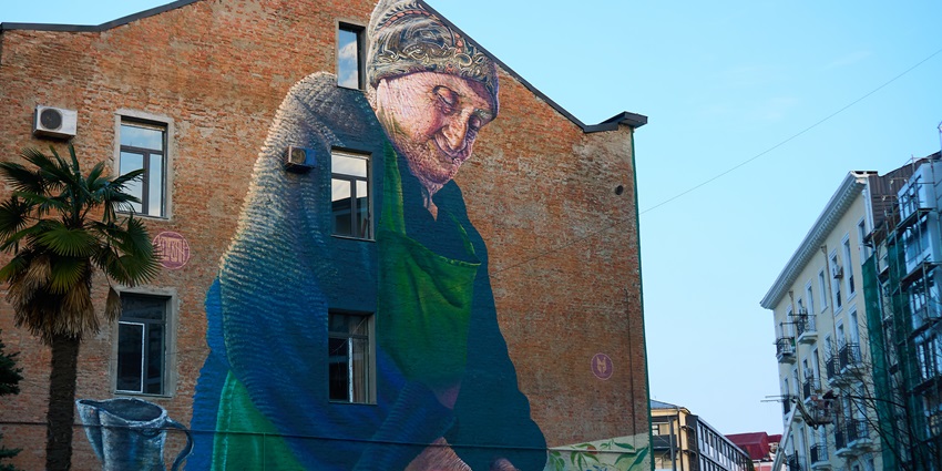 Explore the striking street art mural blending urban style with Georgian culture - one of the things to do in Kutaisi.