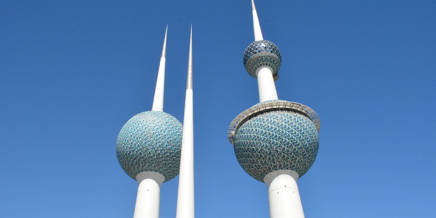 An image of the iconic Kuwait Towers beautifully lit up against the night sky.