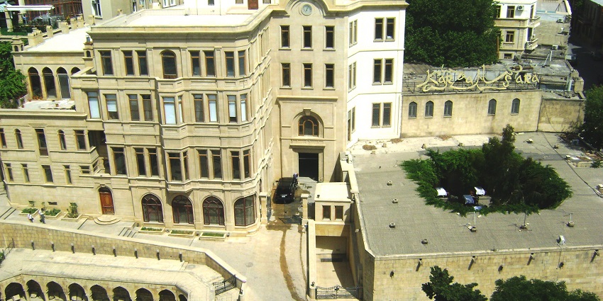 Baku Old City, Azerbaijan blends ancient walls with modern life, near Fountains Square.