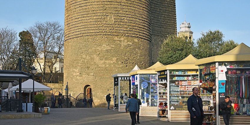 Image of the ancient Maiden Tower lit up, one of the top places to visit Baku at night