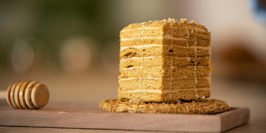 A slice of layered Medovik, honey cake with creamy filling, one of the best foods in Russia.