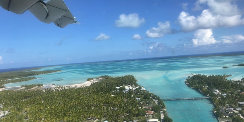 Aerial view of Mataiva Atoll, showcasing its turquoise lagoon and coral formations.