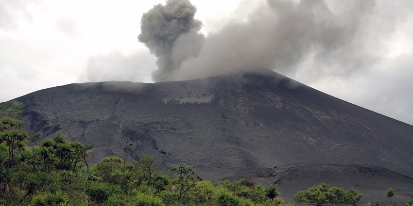 Mount Yasur, with its ashes and smoke erupting across the plains at Tanna, Vanuatu.