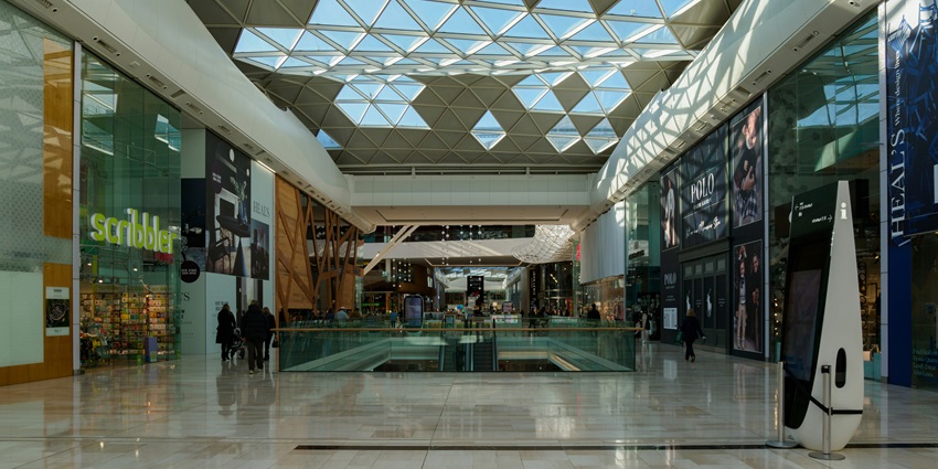 Image of a shopping mall from inside with luxury showrooms and stunning mall architecture