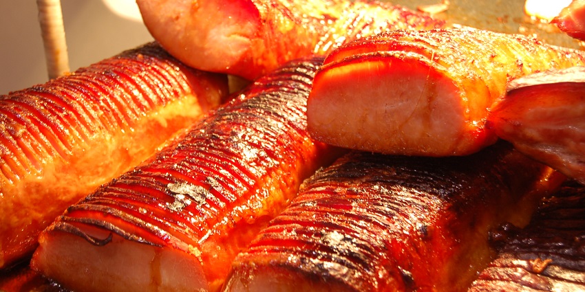 Roasted Peameal Bacon covered with maple glaze at the St. Lawrence Market in Toronto.
