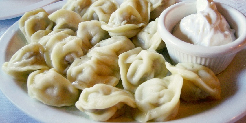 Image of a plate of Pelmeni, dumplings stuffed with meat, a famous food in Russia.