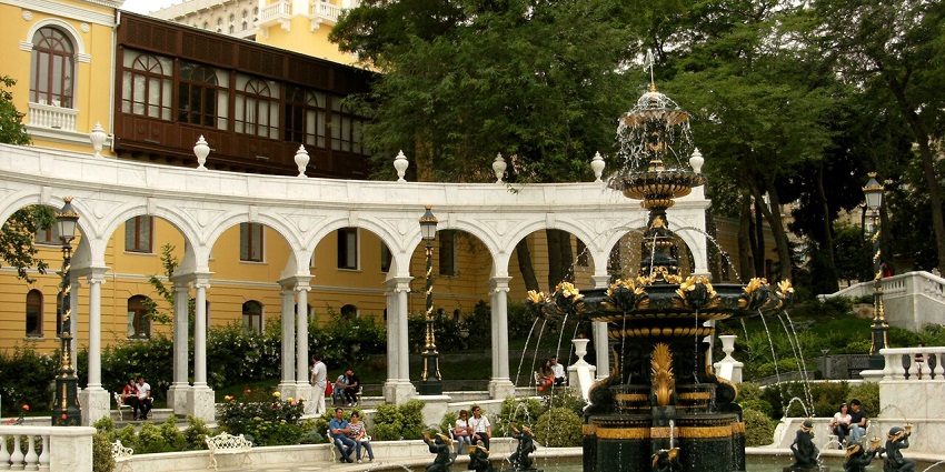 A scenic view of the Philharmonic Fountain, a famous attraction in Baku.