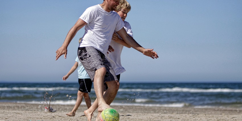 People in Brazil love to play beach soccer, also known as futebol de areia.