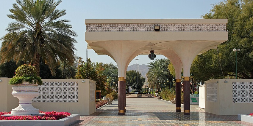 Scenic view of Qurum Natural Park with lake, fountain, green lawns, and flowers–places to visit in muscat in one day