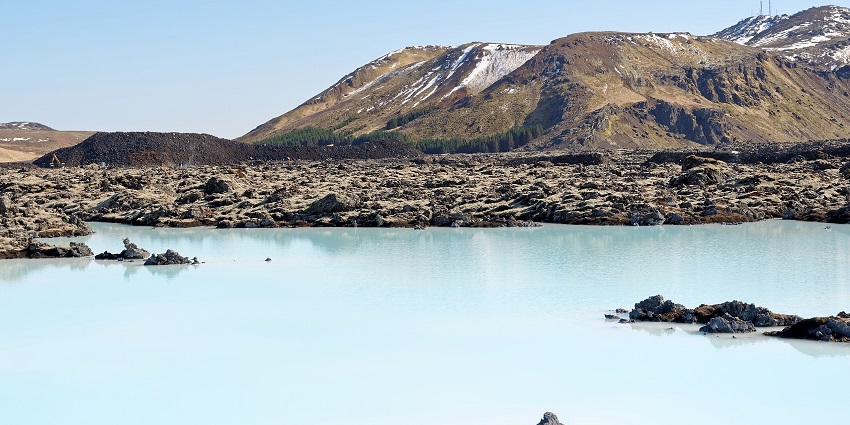 An image of the Blue Lagoon in Iceland, showcasing its milky blue geothermal waters and surrounding lava fields