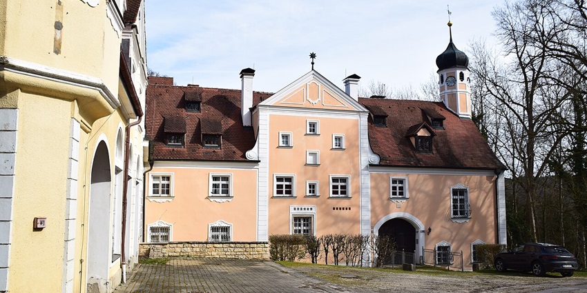 Schloss Wildenstein in Dietfurt, featuring rustic stone walls and arched windows.