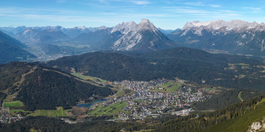 Seefeld in Tirol, Austria, showcasing the town nestled in a valley surrounded by mountains