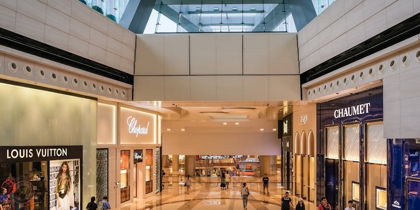Flame Towers Mall interior, a blend of modern design, upscale shops, and vibrant lighting inside the Flame Towers, Baku.
