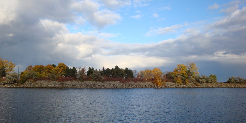 Waterfront Trail in Lakeview, Mississauga, featuring a serene lake and city skyline.