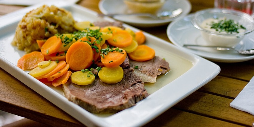 An image of Tafelspitz, a traditional Austrian boiled beef dish served with horseradish.