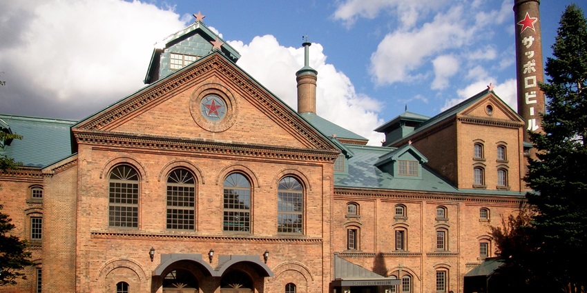A tourist entering Sapporo Beer Museum to try Beers, a chill thing to do in Hokkaido.