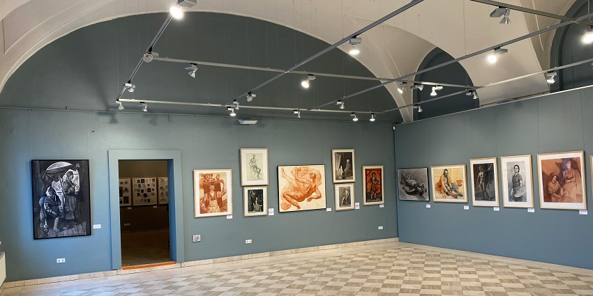 Image from the inside of the art gallery with various paintings at display