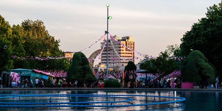 Laleh Park in Tehran, Iran, features lush greenery, walking paths, and a fountain.