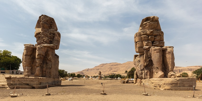 Colossi of Memnon standing tall on Luxor’s west bank, guarding ancient Theban ruins