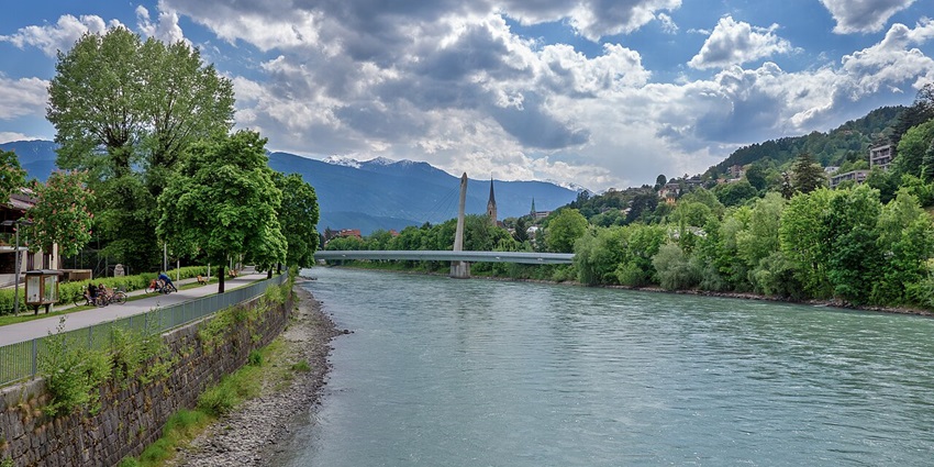 Walk through the Hans-Psenner-Steg Bridge, one of the leisurely things to do in Innsbruck for free.