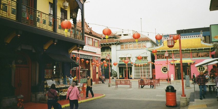 A scene similar to Port Louis' Chinatown depicting daily life and architecture.